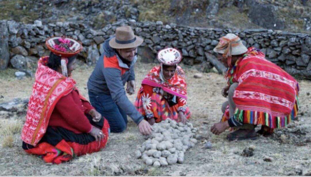 A scene from Episode 2 of Food: Delicious Science, "A Matter of Taste". Host James Wong and a Quechua family detoxifies potat